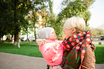 Image showing Beautiful Mother And Baby outdoors.