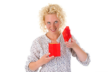 Image showing Young woman opening gift box