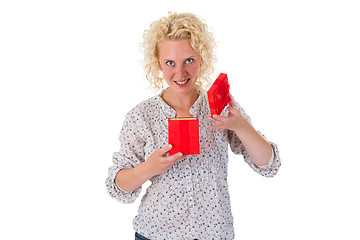 Image showing Young woman looking into a gift box