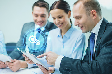 Image showing business team with tablet pc having discussion