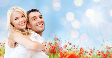 Image showing happy couple having fun over poppy flowers field