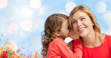 Image showing happy daughter whispering gossip to her mother