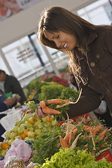 Image showing Woman in a vegetable market.