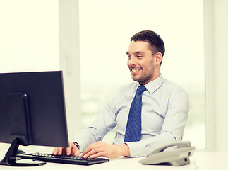 Image showing smiling businessman or student with computer