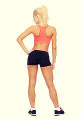 Image showing athletic woman in sportswear from the back