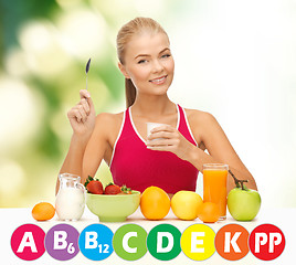 Image showing happy woman with organic food and vitamins