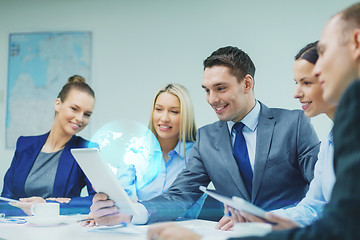 Image showing business team with tablet pc having discussion