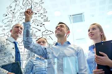 Image showing smiling business people with marker and stickers