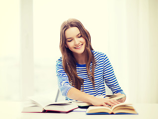 Image showing happy smiling student girl with books