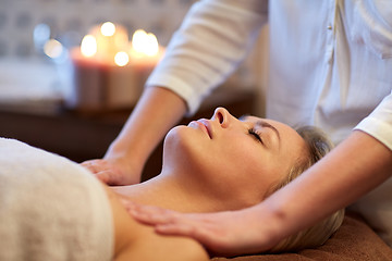 Image showing close up of woman lying and having massage in spa