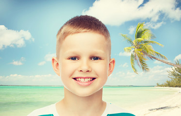 Image showing smiling little boy over green background