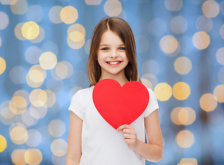 Image showing smiling little girl with red heart