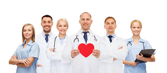 Image showing group of smiling doctors with red heart shape