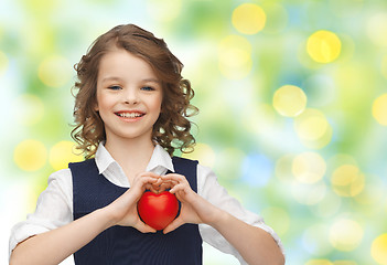 Image showing smiling little girl with red heart