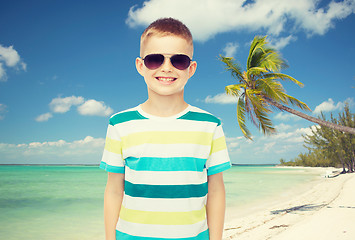 Image showing smiling little boy over green background