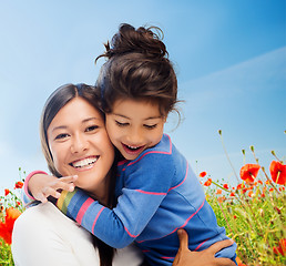 Image showing happy mother and daughter hugging