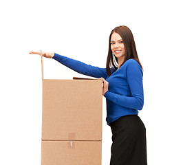 Image showing businesswoman with big boxes