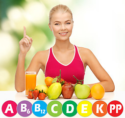 Image showing happy woman with organic food and vitamins