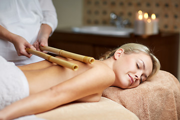 Image showing close up of woman lying and having massage in spa