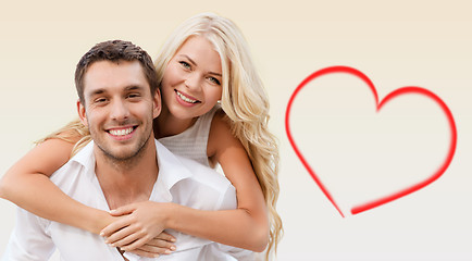 Image showing happy couple having fun over beige background