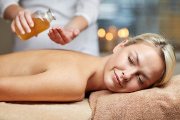 Image showing close up of woman lying on massage table in spa