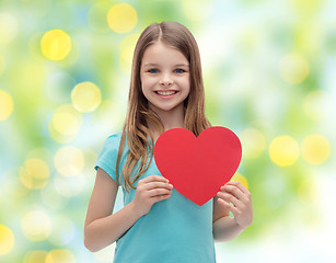 Image showing smiling little girl with red heart