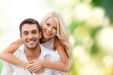 Image showing happy couple having fun over green background