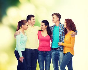 Image showing group of smiling teenagers over green background