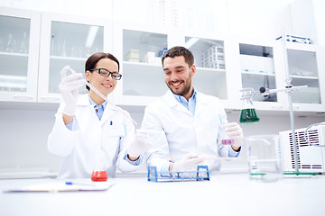 Image showing young scientists making test or research in lab