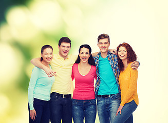 Image showing group of smiling teenagers over green background