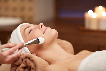 Image showing close up of young woman and cosmetologist in spa