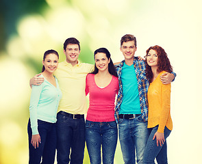 Image showing group of smiling teenagers over green background