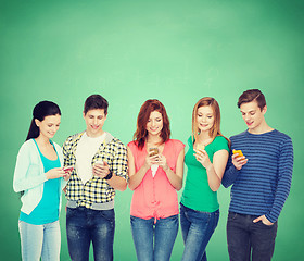 Image showing smiling students with smartphones