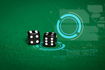 Image showing close up of black dice on green casino table