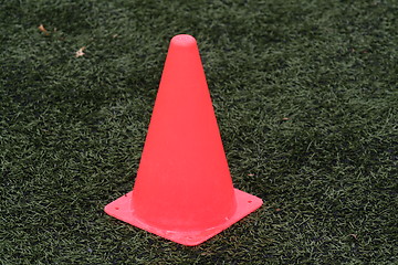 Image showing Orange cone on fotball field