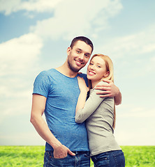 Image showing smiling couple hugging