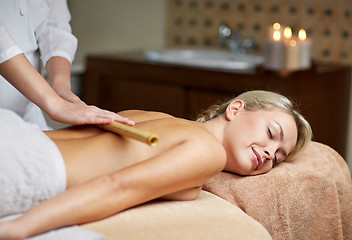 Image showing close up of woman lying and having massage in spa