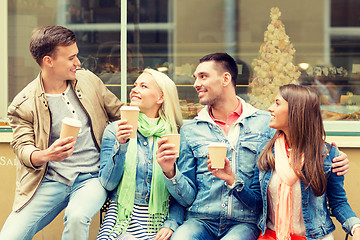 Image showing group of smiling friends with take away coffee