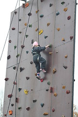 Image showing Girl climbing a wall