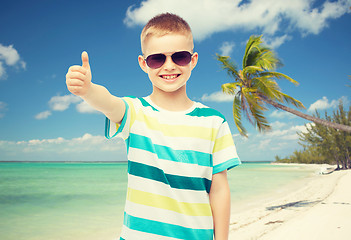 Image showing smiling little boy over green background