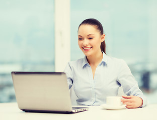 Image showing smiling businesswoman or student with laptop