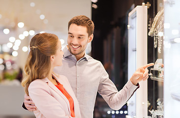 Image showing couple looking to shopping window at jewelry store