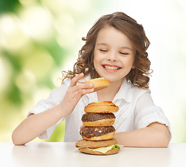 Image showing happy smiling girl with junk food