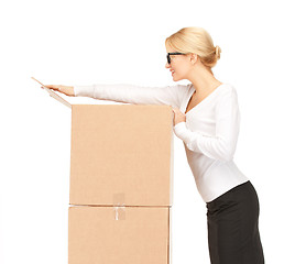 Image showing businesswoman with big boxes