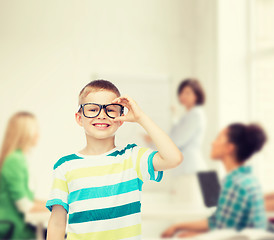 Image showing smiling little boy in eyeglasses