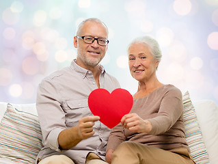 Image showing happy senior couple with red heart shape