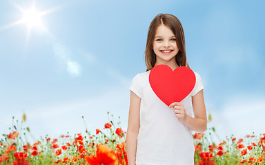 Image showing smiling little girl with red heart