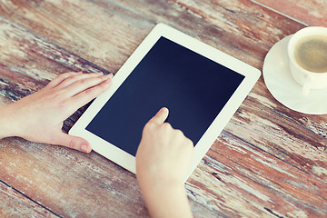 Image showing female pointing finger to tablet pc screen