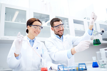 Image showing young scientists making test or research in lab