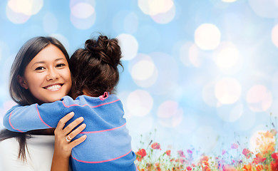 Image showing happy mother and daughter hugging